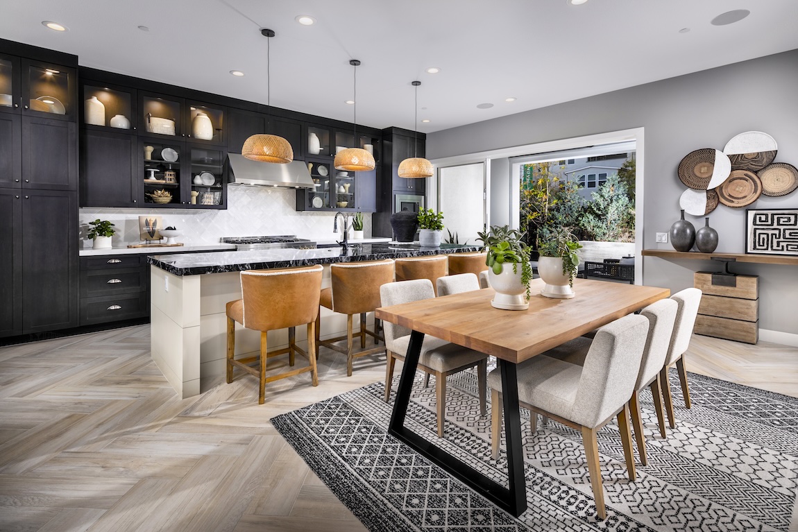 Modern kitchen and dining space with wooden accents.