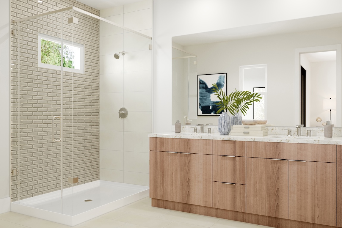 Primary bathroom with wood vanity, textured tile shower, glass enclosure, and clean-lined fixtures.