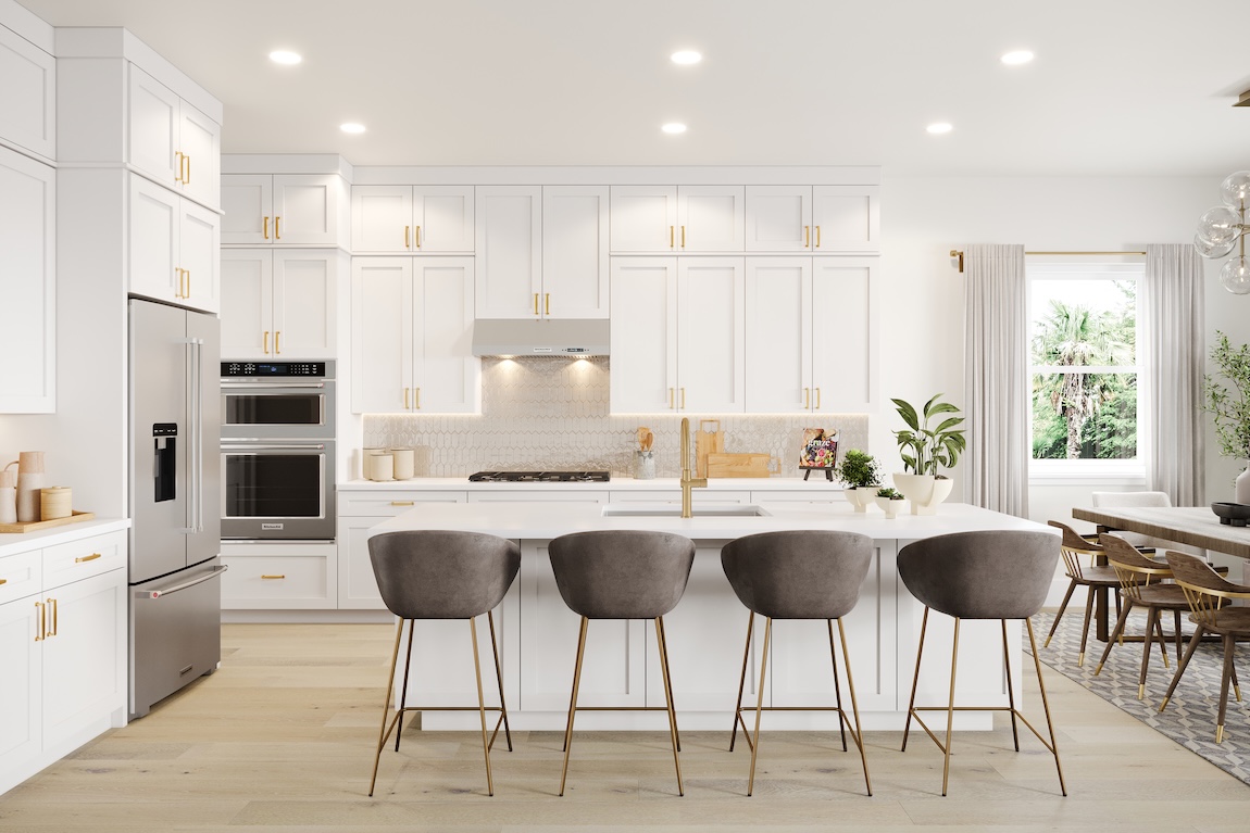 Warm contemporary kitchen with white shaker cabinetry, brass hardware, large island with upholstered bar stools, and light wood flooring.