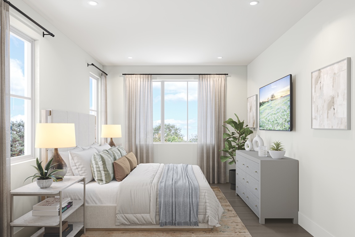 Cool contemporary bedroom with soft neutral bedding, streamlined furniture, large windows, and minimal layered decor.