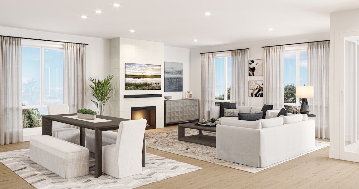 Bright open-concept living and dining space with fireplace, neutral seating, large windows, and a wood dining table with upholstered chairs.