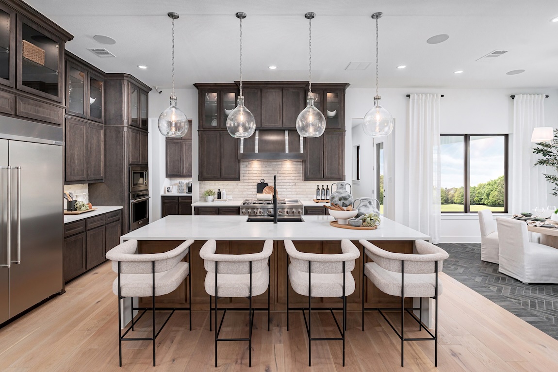 modern kitchen with barstool and dark wood cabinetry