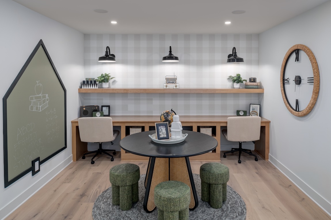 study space with built-in wooden desk and a craft table.