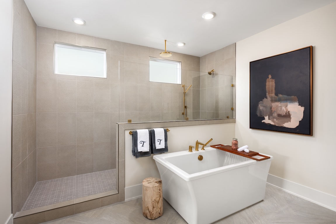 primary bathroom with freestanding tub and large shower