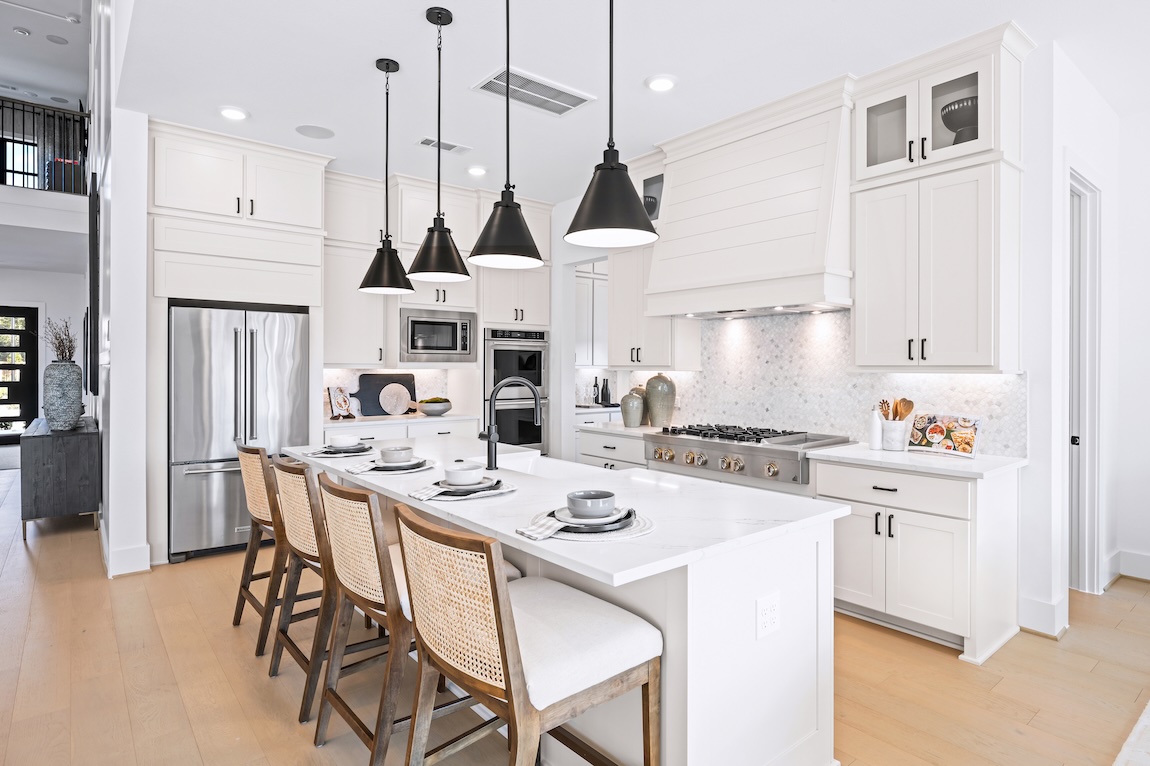 Modern kitchen with white cabinetry and black fixtures