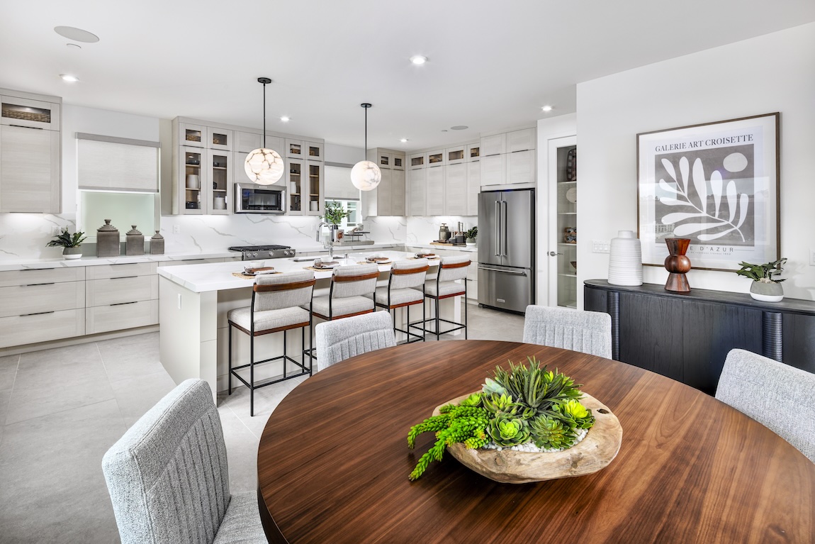 luxury kitchen and dining space with a neutral color palette.