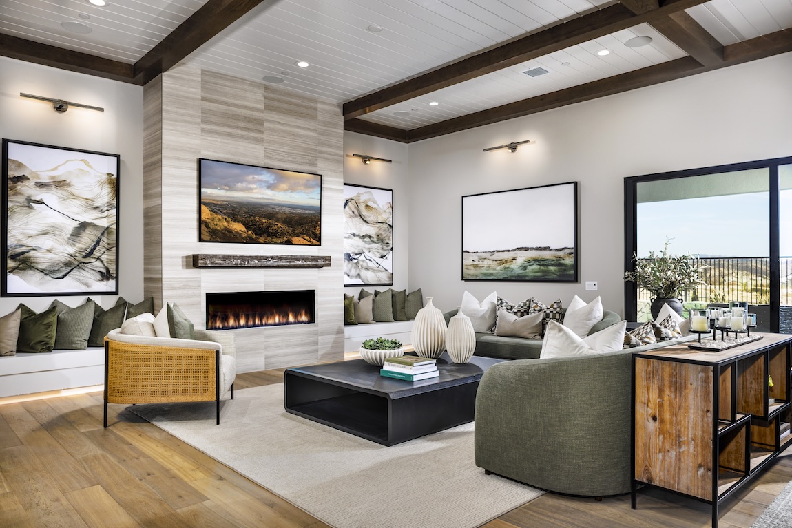 luxury great room with sliding glass doors and wood beam ceiling