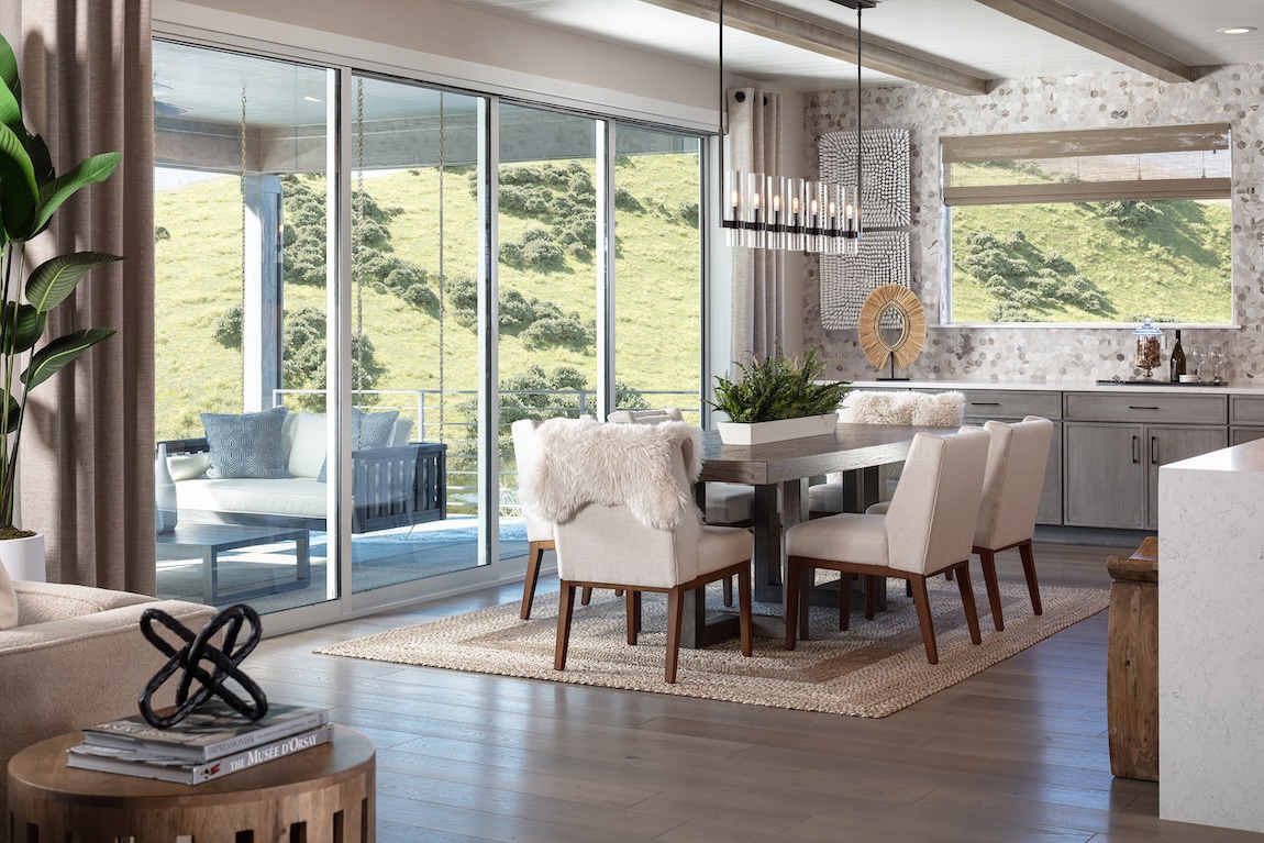 dining room with wooden table and access to the outdoor living space.