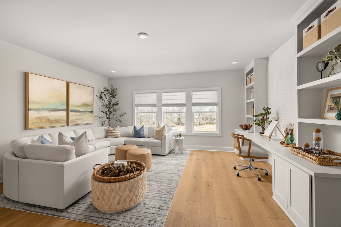 living space with large couch and built-in desk area