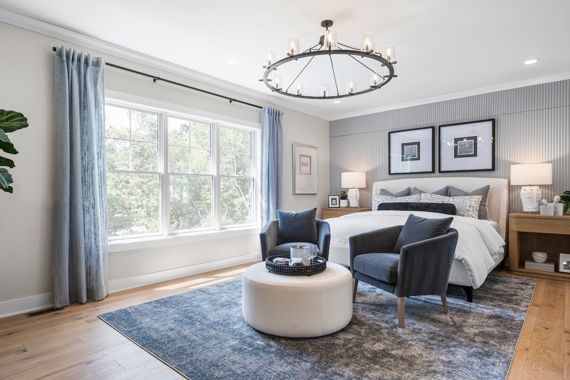 primary bedroom with accent wall and blue colors