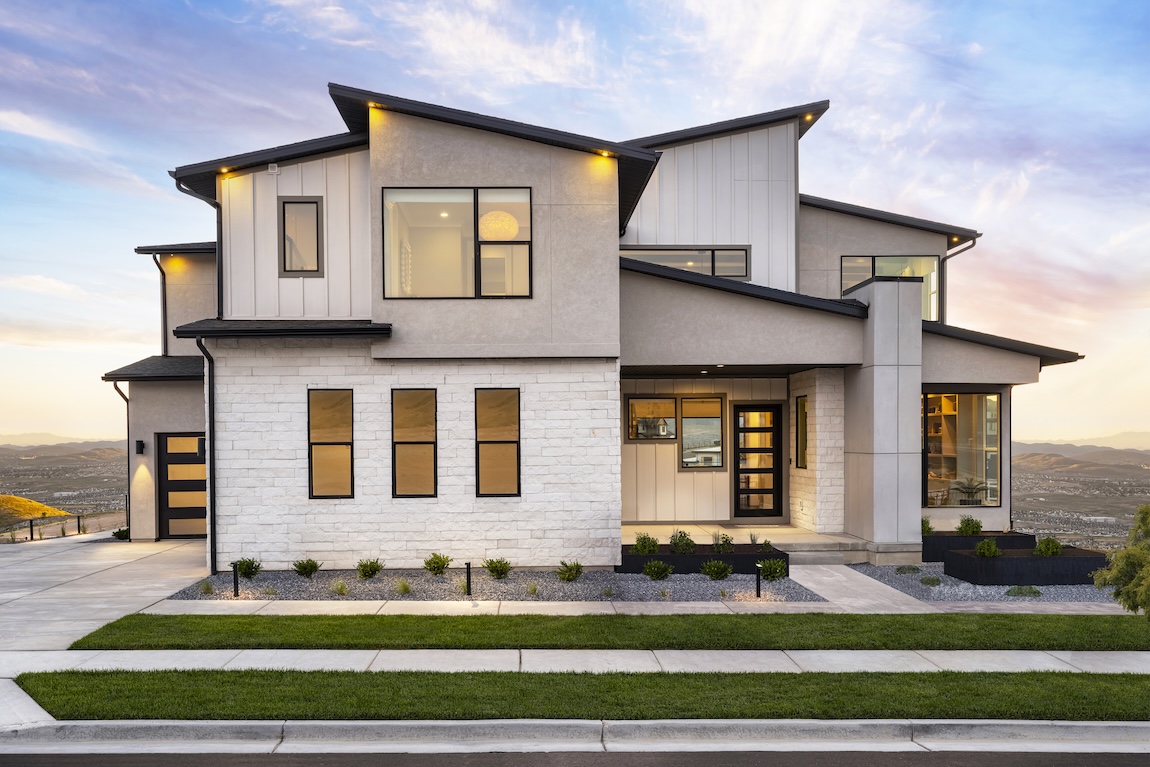 home exterior with green landscaping and black trim