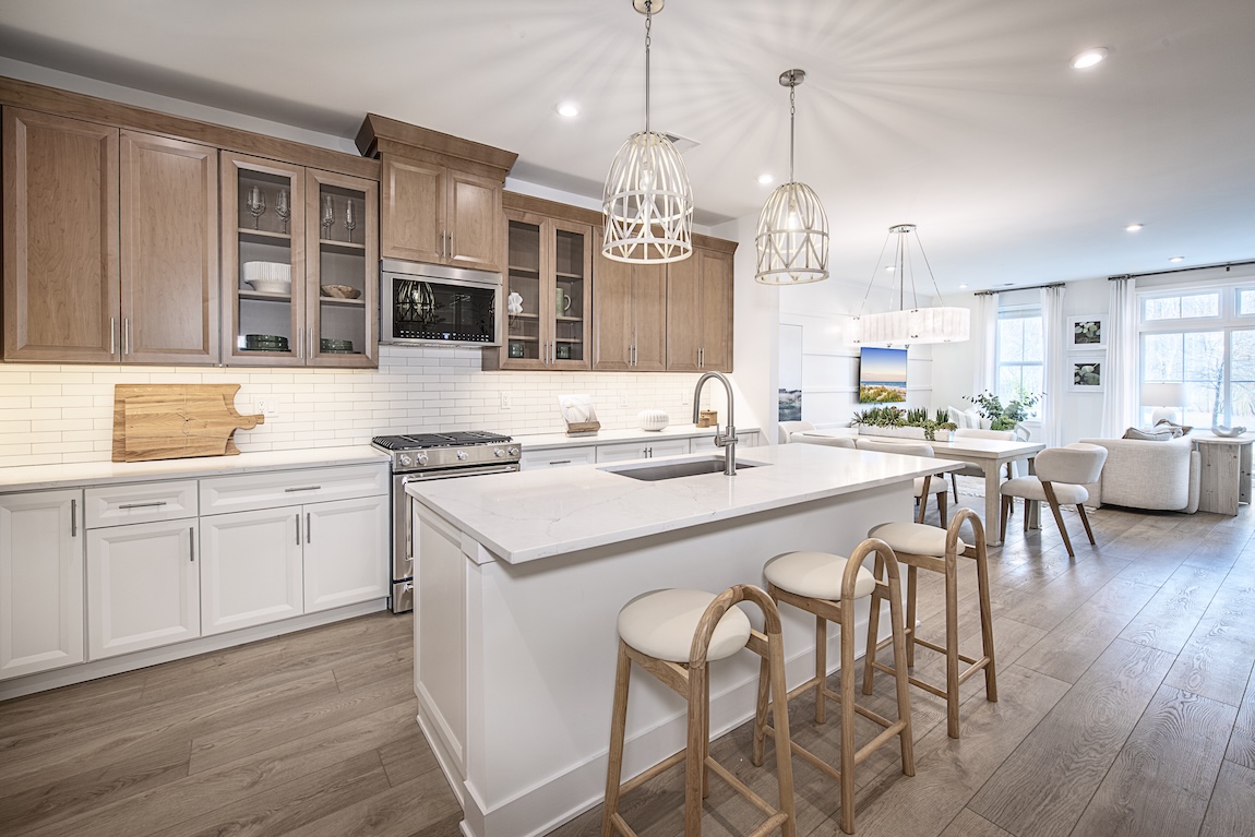 modern kitchen with wooden cabinets and marble countertops