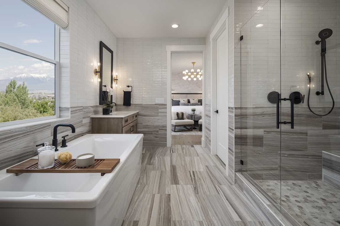 primary bathroom with freestanding tub and walk in shower