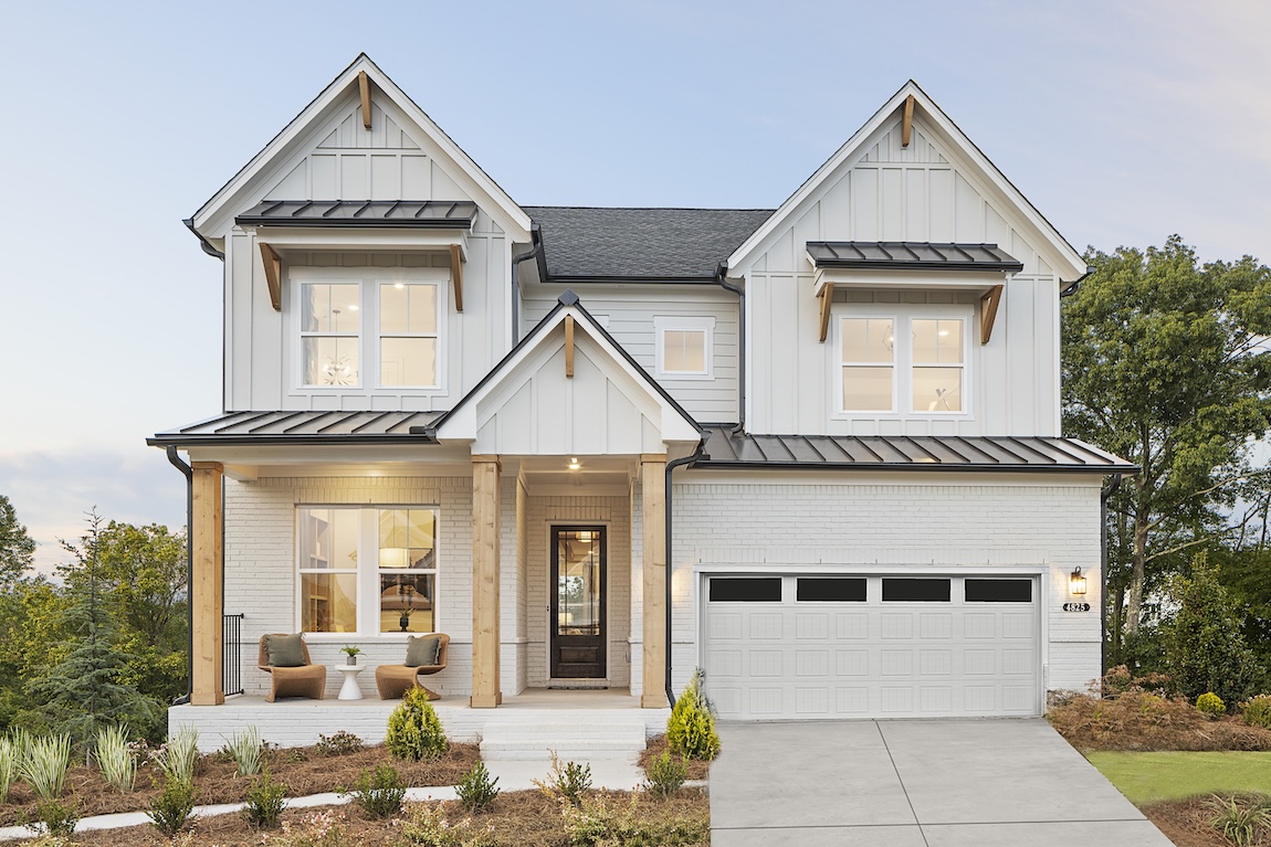 exterior of modern farmhouse with wood and black accents