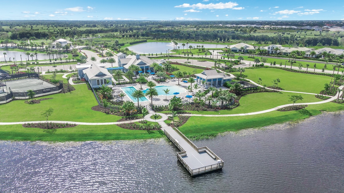 luxury amenity center with a pool and water views.