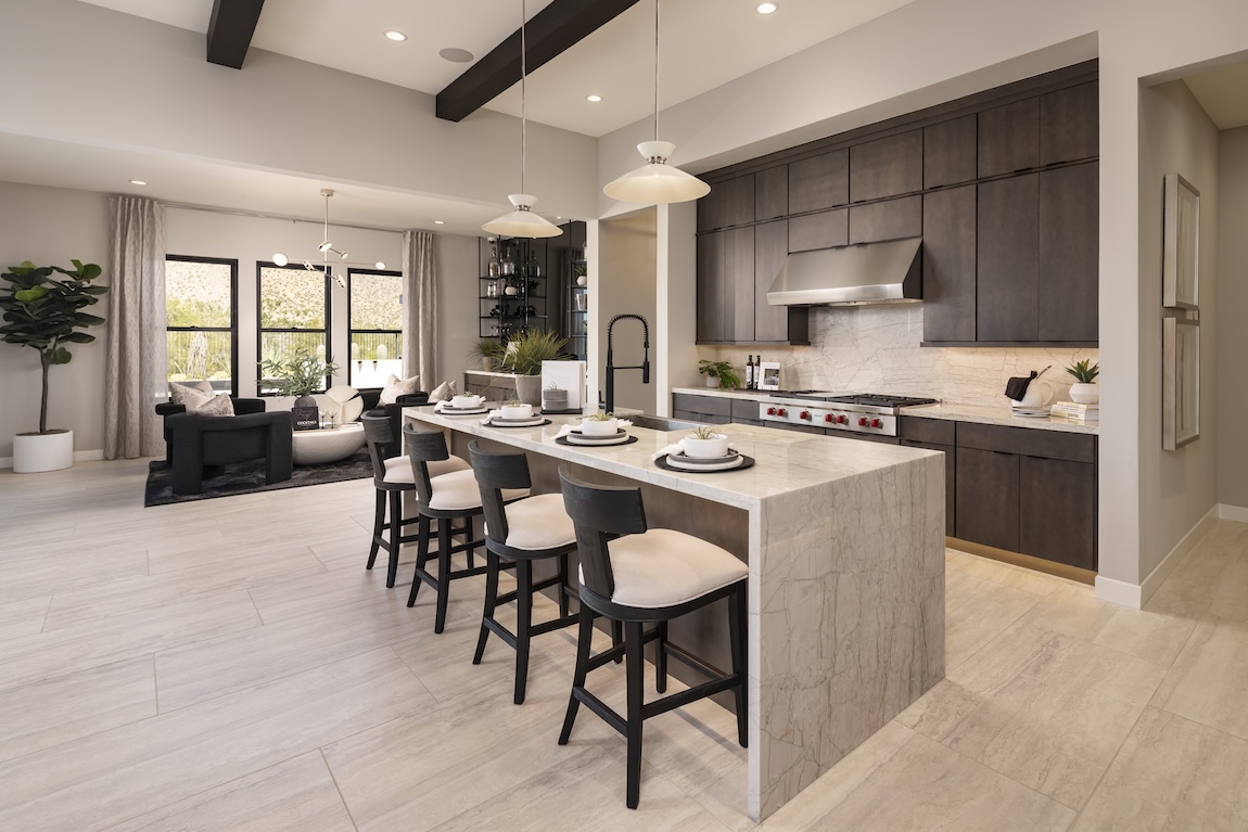 modern kitchen with waterfall island and wooden cabinetry