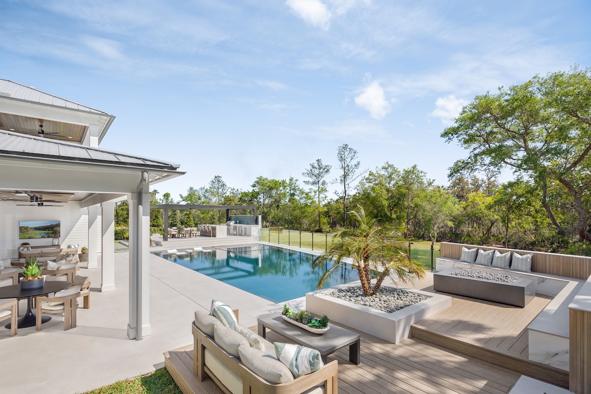 outdoor living space with pool and seating areas