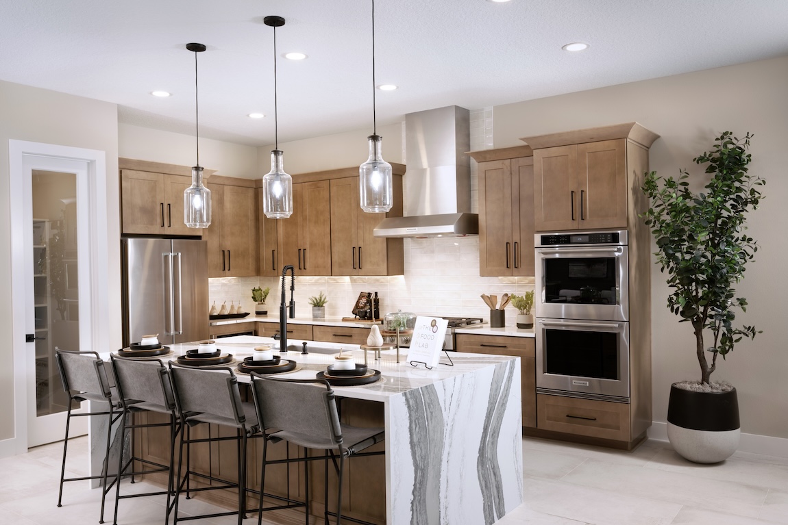kitchen with waterfall island and wooden cabinetry