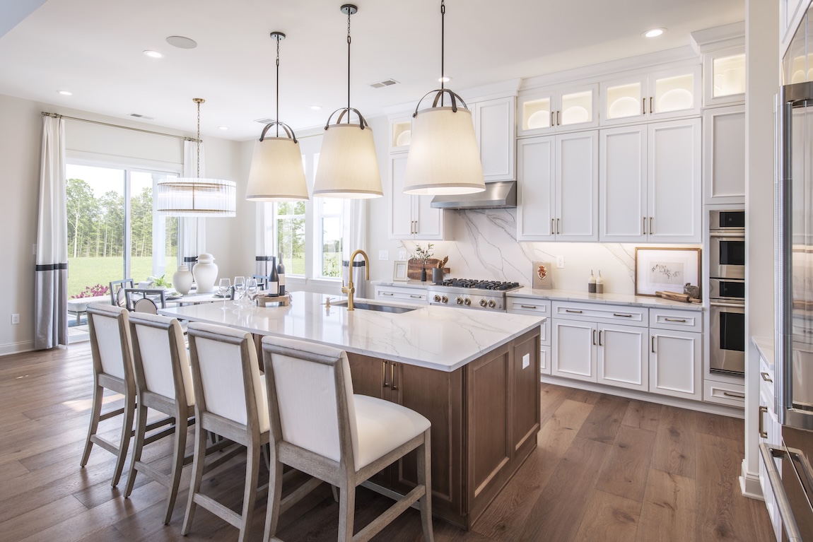 modern kitchen with wood and white cabinets