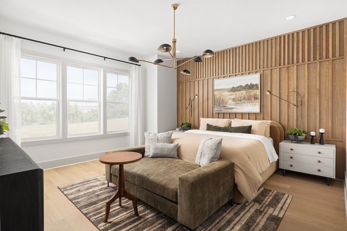 primary bedroom with wooden accent wall