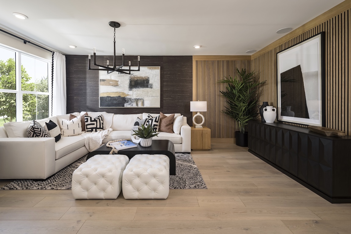 living room with sectional sofa and wooden accent wall