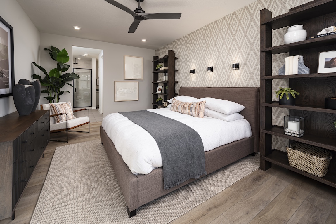 primary bedroom with wallpaper accent wall