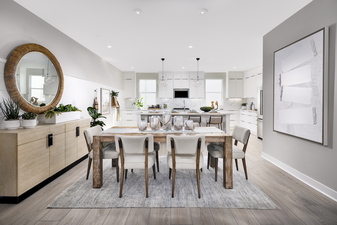 modern dining room leading to the kitchen space.