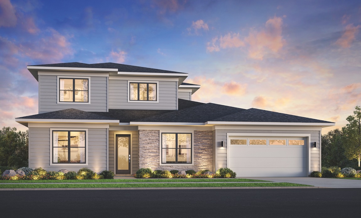 Modern two-story home exterior in Ridgefield, Washington, with gray siding, stone accents, and landscaped front yard at sunset.