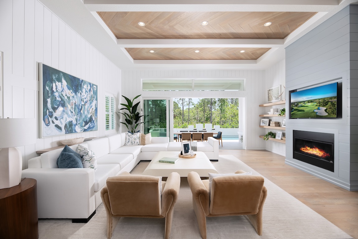 Coastal living room with sliding glass doors to the outdoor living space.