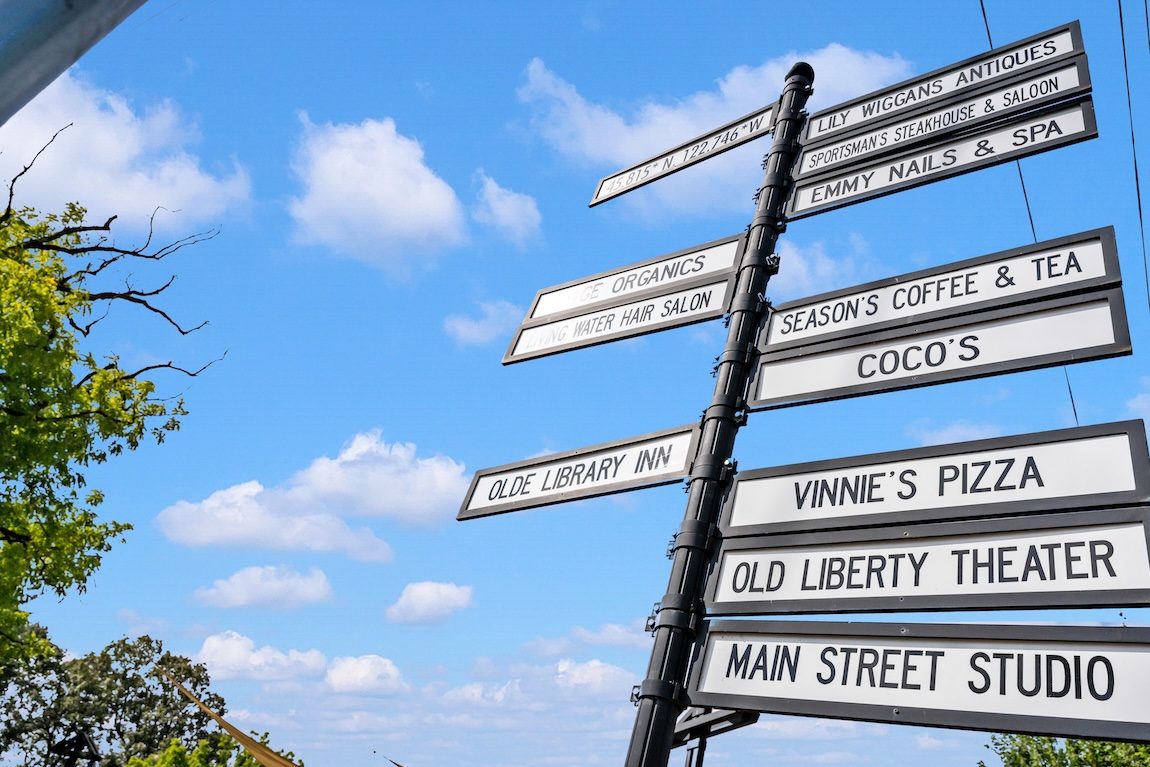 Directional signpost featuring local shops, restaurants, and attractions in downtown Ridgefield, Washington.