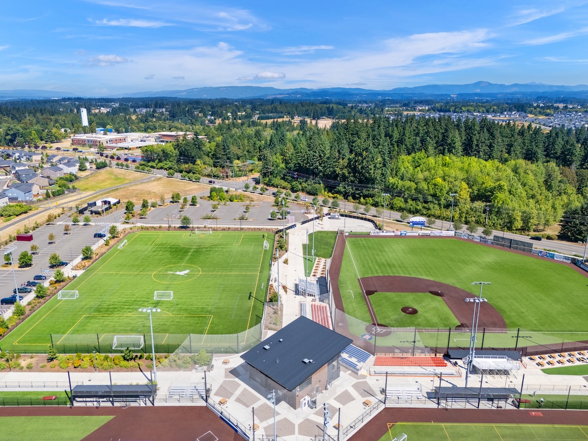 Aerial view of sports fields, baseball diamonds, and surrounding greenery in Ridgefield, Washington.