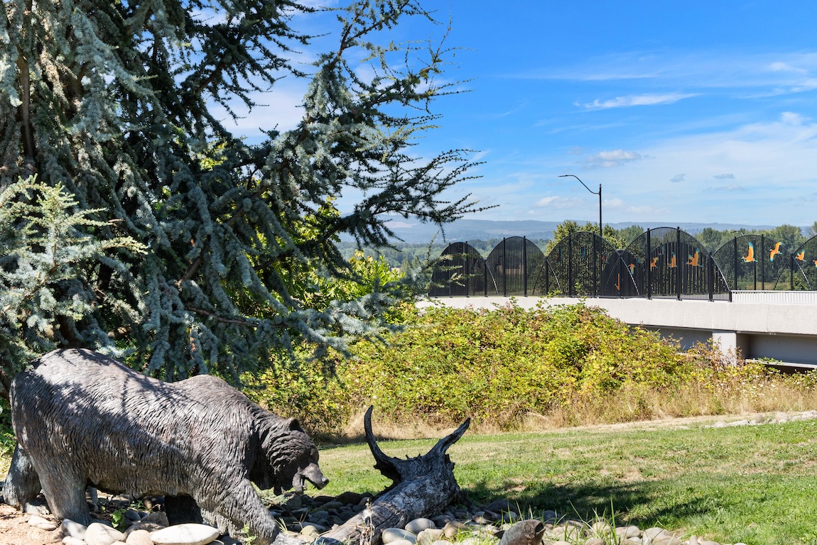 Outdoor sculpture and scenic overlook surrounded by trees and natural landscape in Ridgefield, Washington.