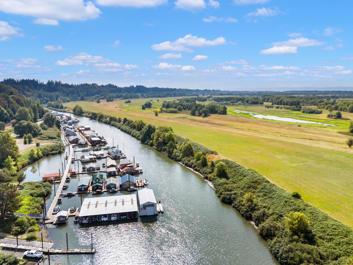 Aerial view of riverfront marina and wetlands landscape near Ridgefield, Washington.