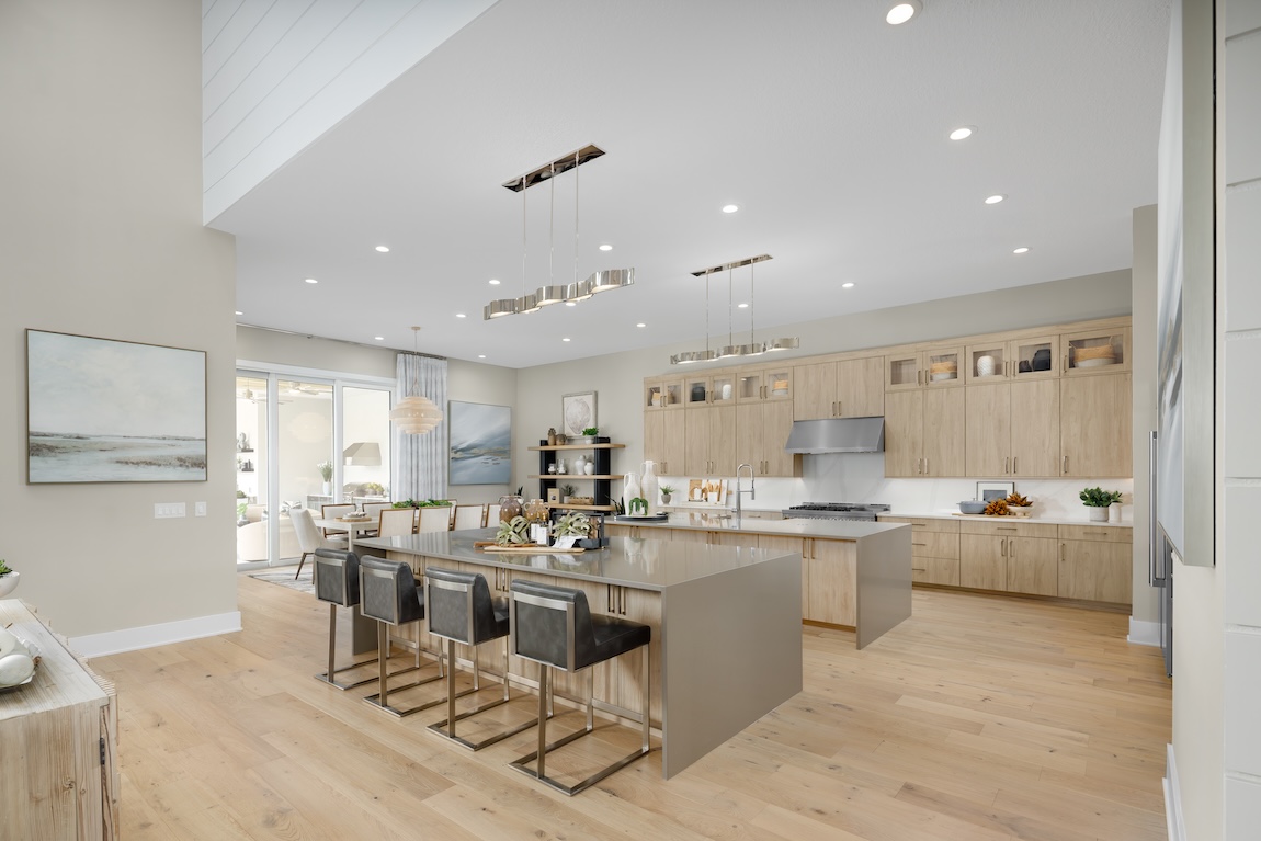 modern kitchen with wooden cabinetry and double waterfall islands