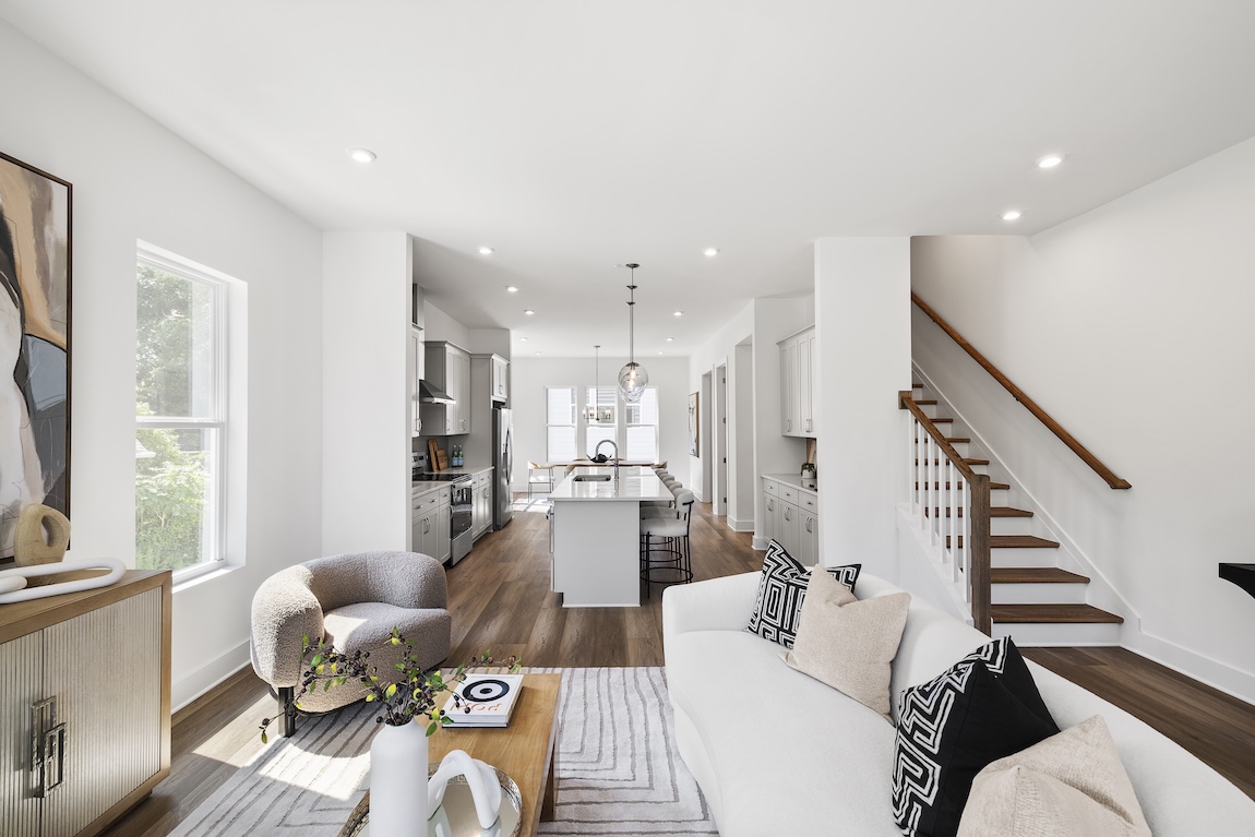 modern living room and kitchen with white color palette.