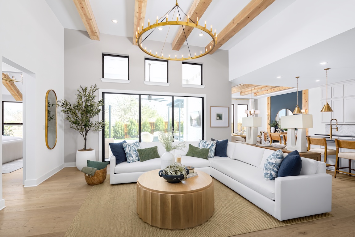 modern great room with wood beam ceiling