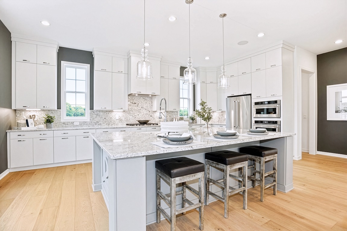 White modern kitchen design in luxury townhome