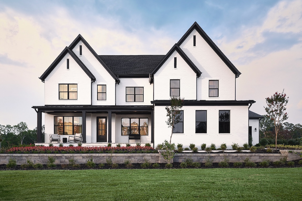 exterior of modern home that is white with black detailing