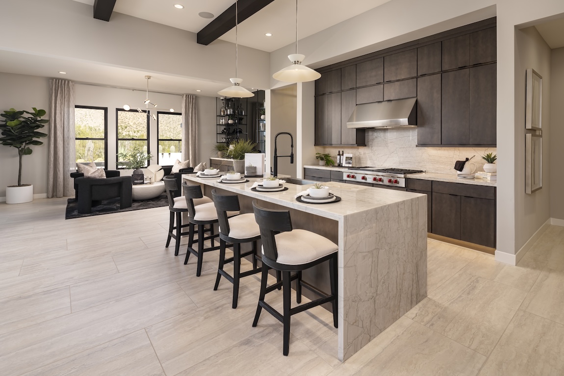 modern kitchen with waterfall island and black seats