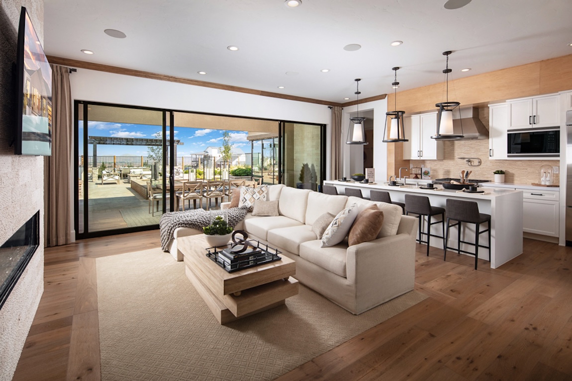 living room and kitchen with glass sliding doors to the outdoor living space