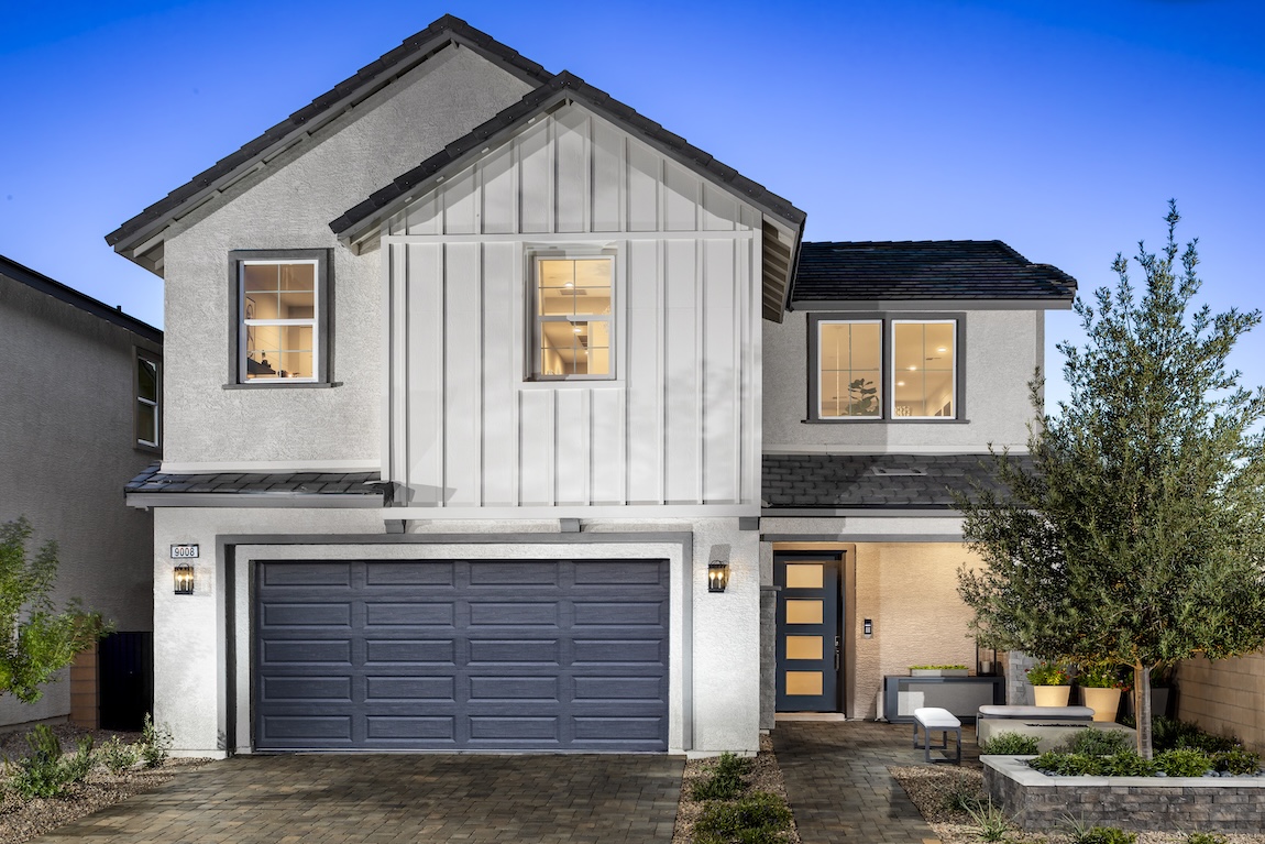 exterior of modern home with warm interior lighting.