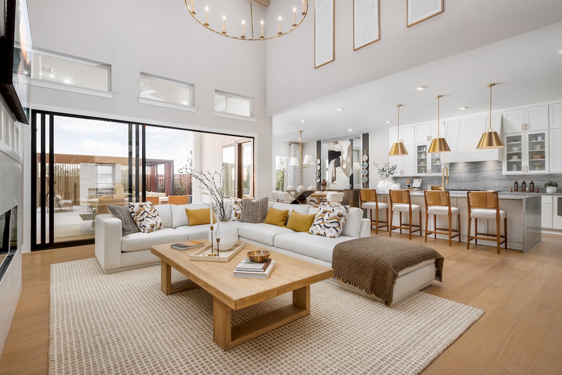 modern great room with sectional sofa and views of the kitchen.