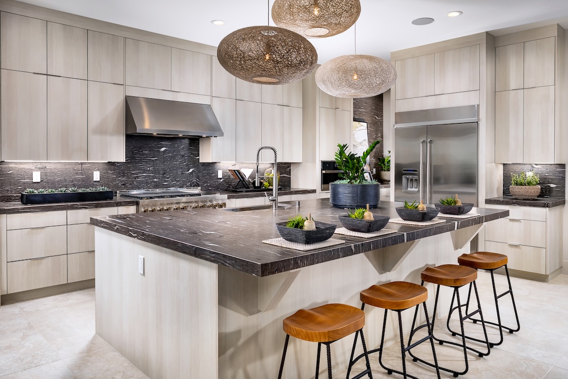 modern kitchen with dark countertops and wooden features