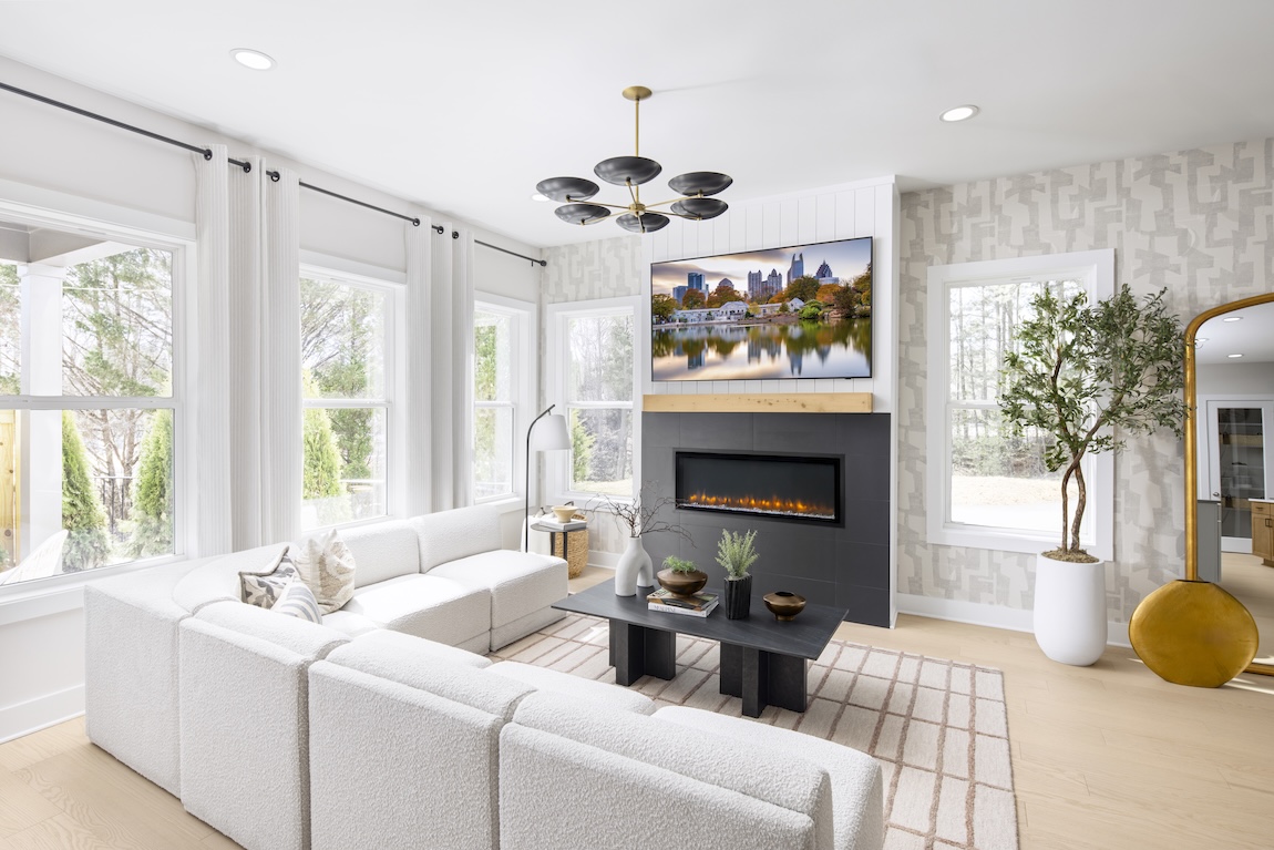living room with white sofa and accent wall