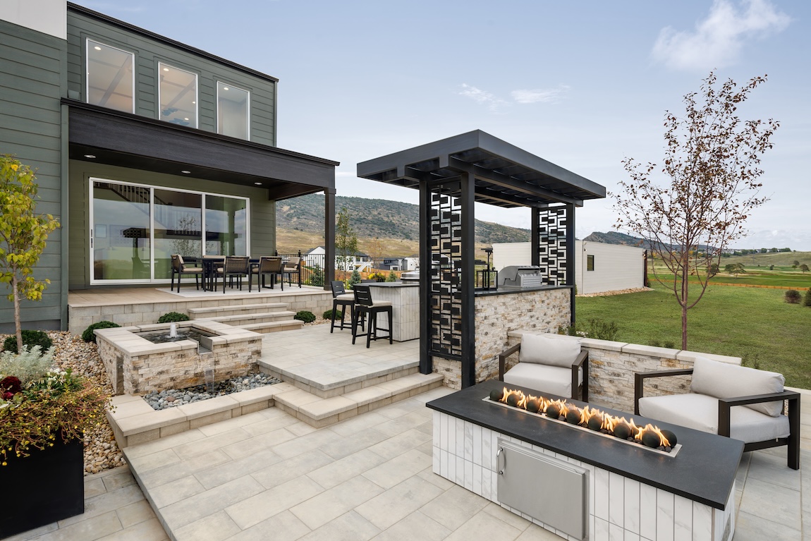 backyard space with a firepit and kitchen area.