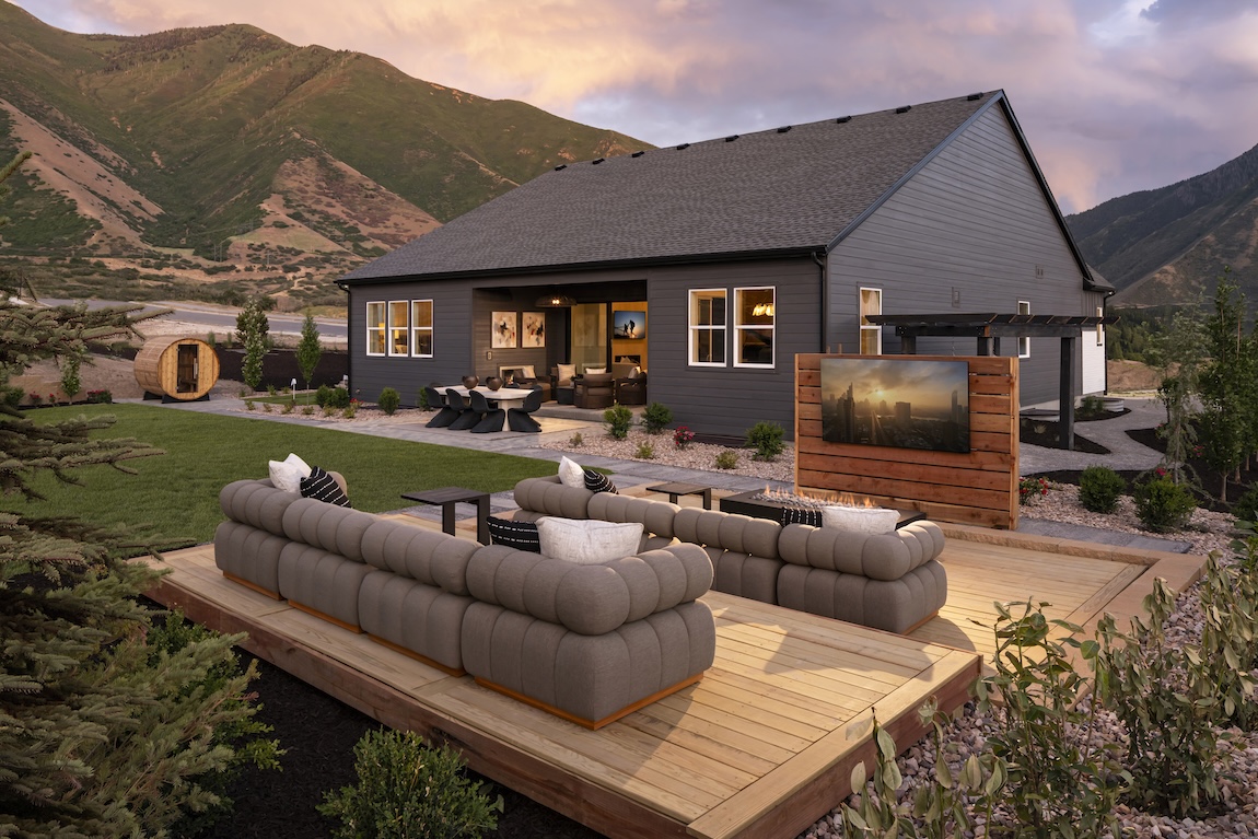 modern outdoor living space with couches and TV