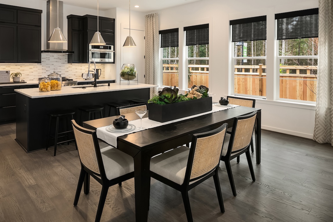 kitchen and dining area with black and white features