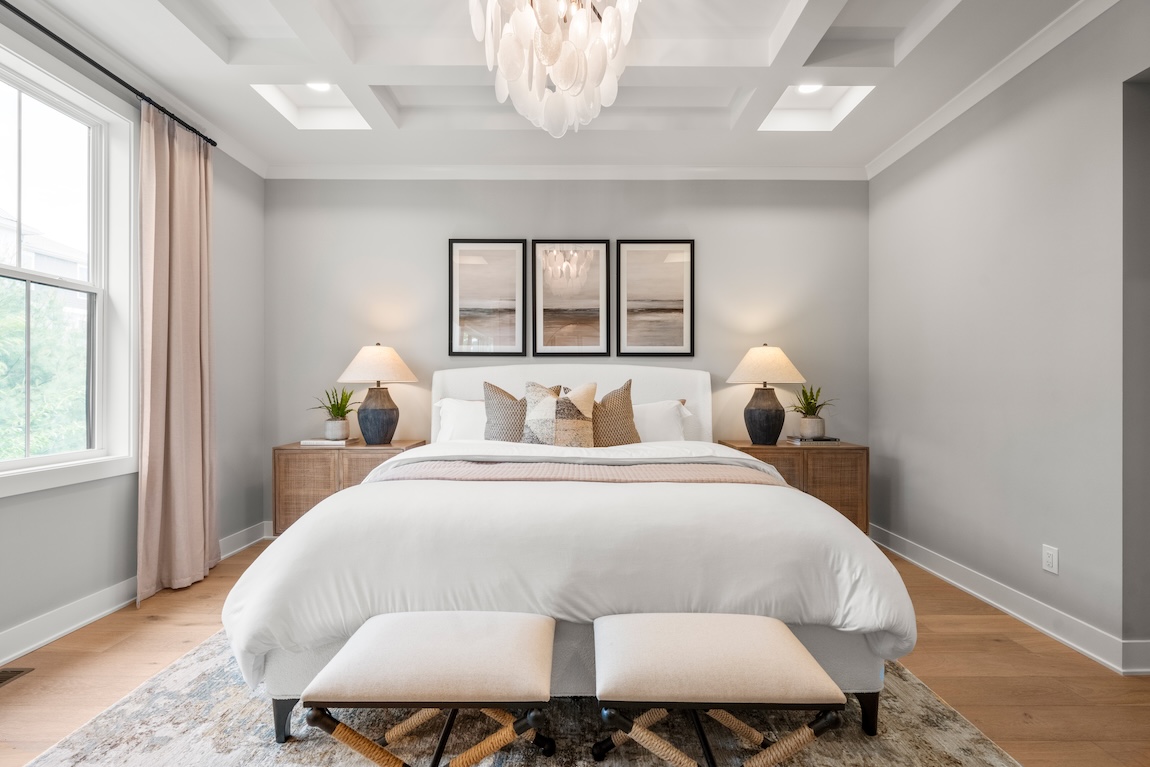 primary bedroom with accent ceiling.