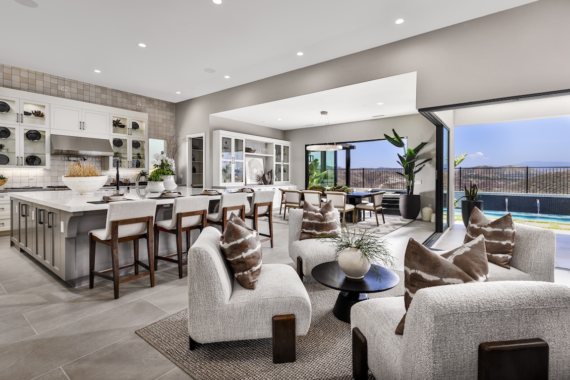 great room and kitchen with glass doors opening to the outdoor space