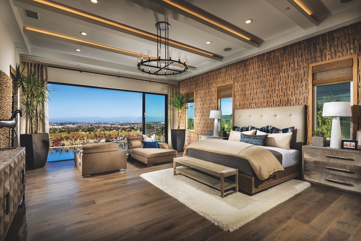 primary bedroom with sliding glass doors to outdoor living area with views